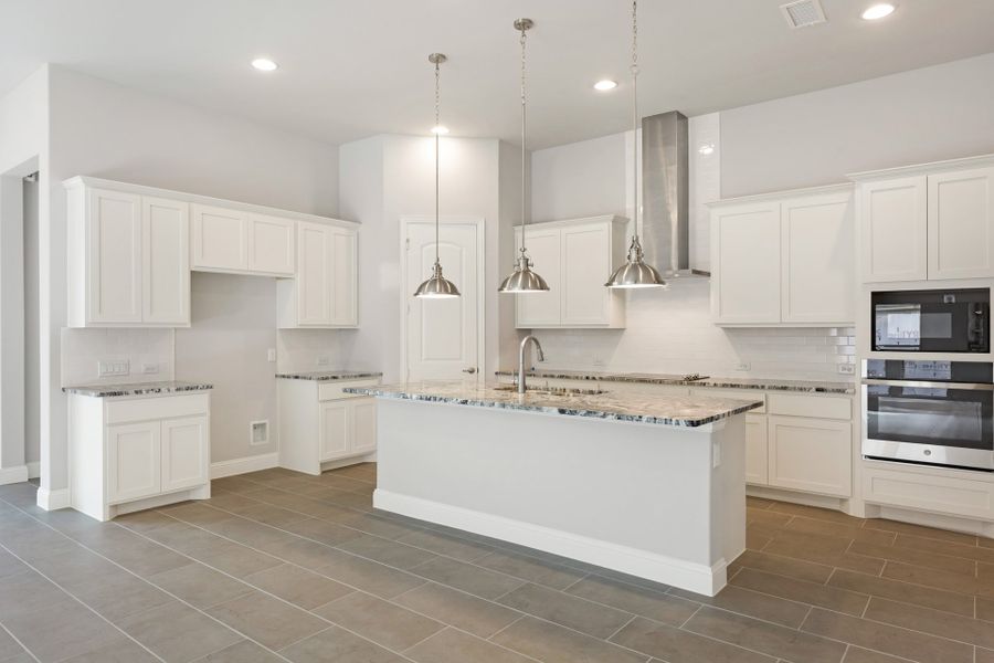 Representative furnished interior of a home built from the Bridgeport by UnionMain Homes in Lake Breeze, Lavon (Image 13).