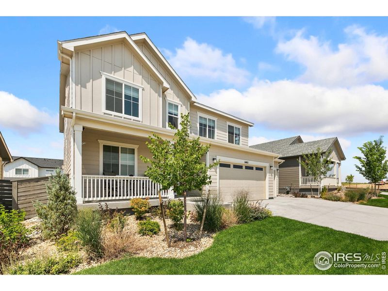 Front exterior of a new home in Kinston at Centerra, Loveland, CO, highlighting curb appeal (Image 23).