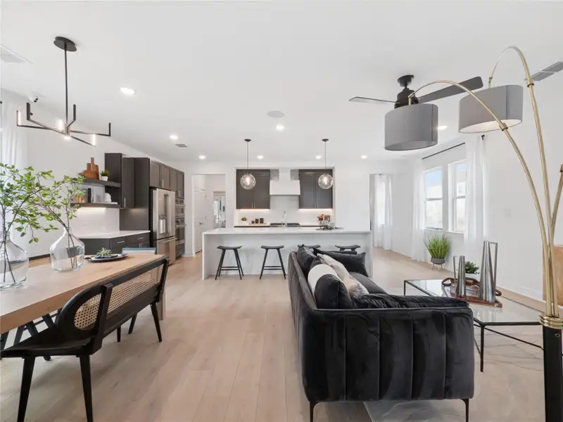 Sun-lit dining area and great room (*Photo not of actual home and used for illustration purposes only.)