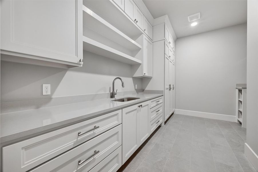 A huge laundry room is situated on the first floor. A huge laundry room is situated on the first floor.