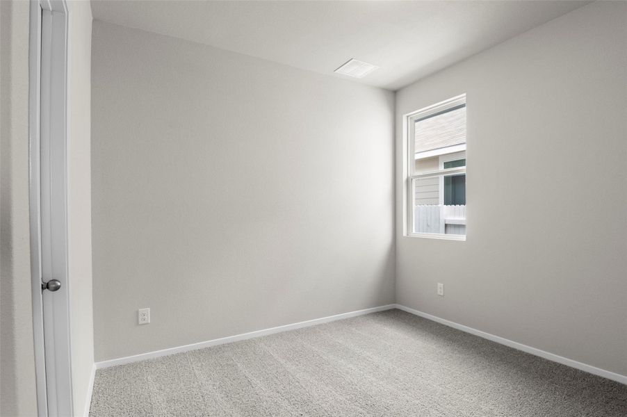 Unfurnished room featuring carpet floors and baseboards