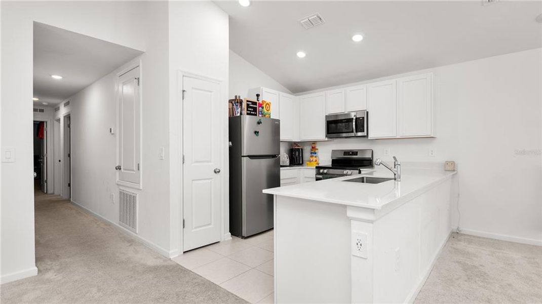 Furnished interior view inside a new home in Peace Creek Reserve: Legacy Collection, Winter Haven (Image 7).