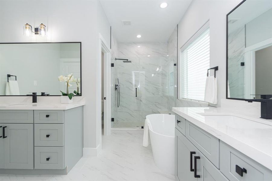 The combination of separate sinks, a soaking tub, and a walk-in shower offers convenience and luxury.