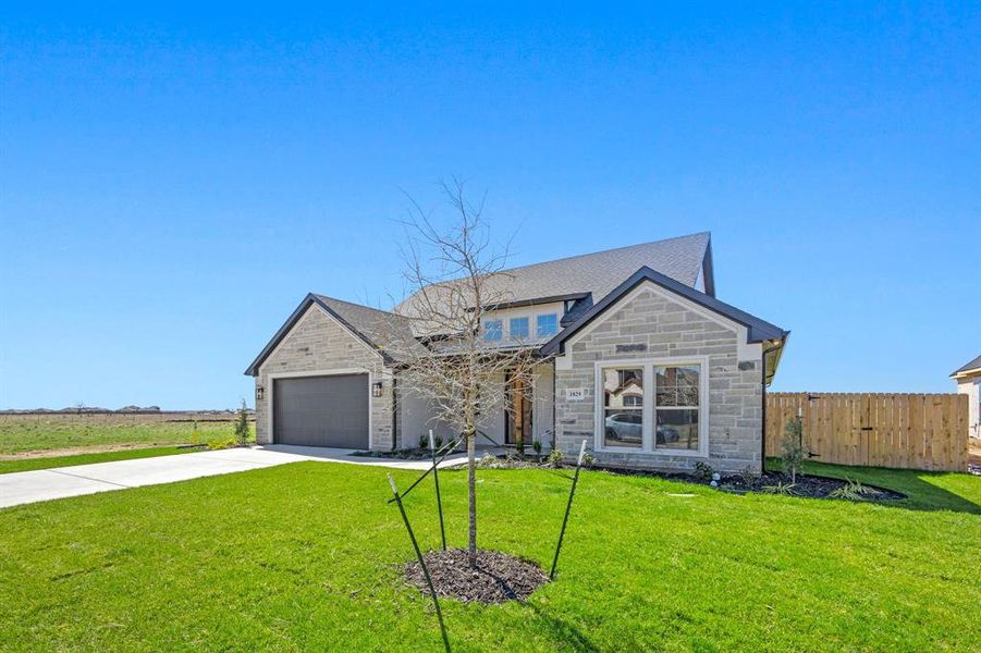 Front exterior of a new home in , Cleburne, TX, highlighting curb appeal (Image 22).