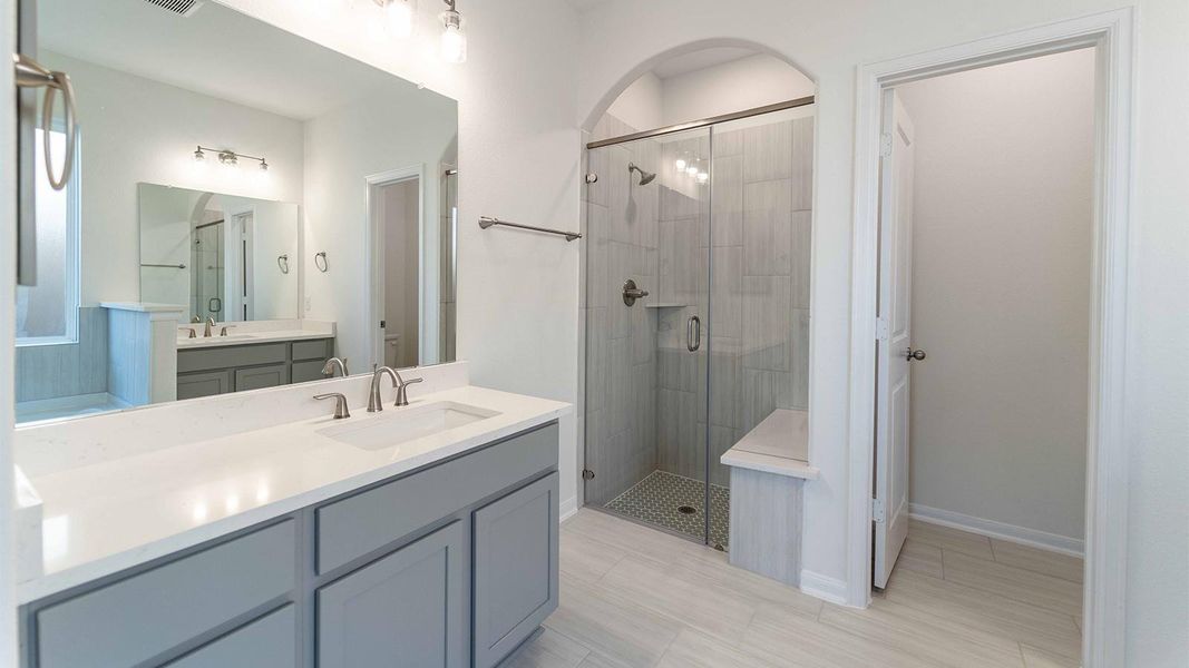 Bathroom with vanity and a shower stall
