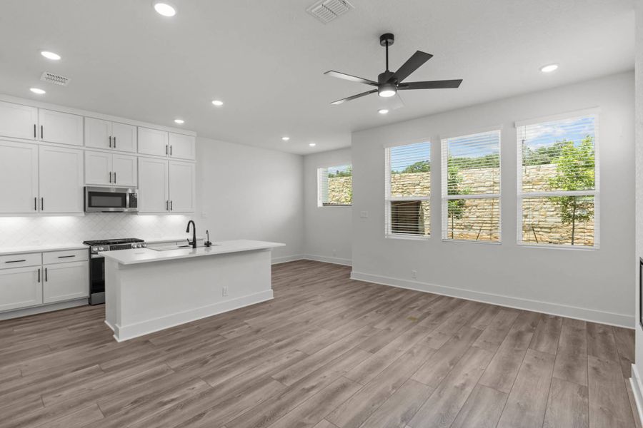 Representative furnished interior of a home built from the Balder by Chesmar Homes in Centero at Stone Oak, San Antonio (Image 5).