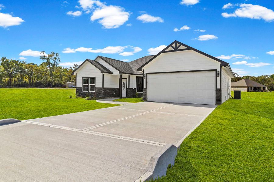 Front exterior of a new home in , Trinity, TX, highlighting curb appeal (Image 17).
