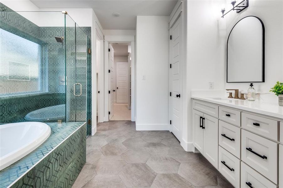 Master Bathroom featuring vanity, a bath, and a stall shower