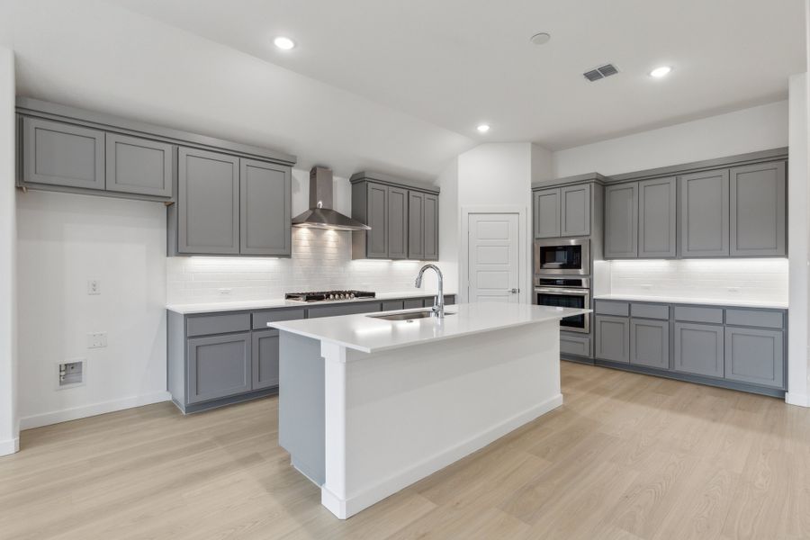 Kitchen in the Gilmour II home plan by Trophy Signature Homes – REPRESENTATIVE PHOTO