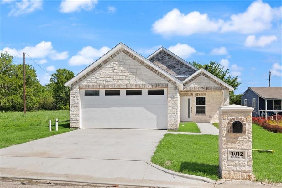 Front exterior of a new home in , Royse City, TX, highlighting curb appeal (Image 2). Front exterior of a new home in , Royse City, TX, highlighting curb appeal (Image 2).