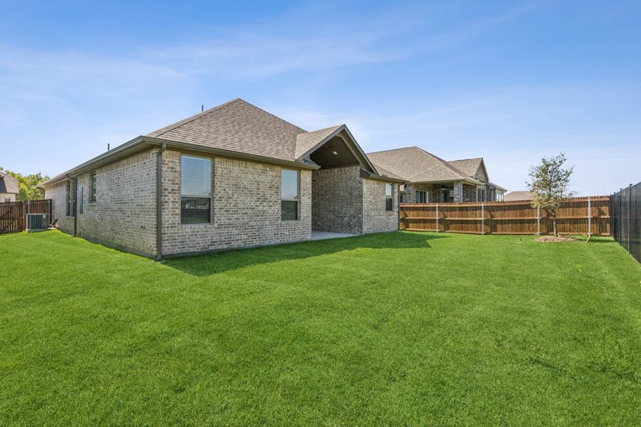 Exterior details and patio area of a home in Oaks of North Grove, Waxahachie (Image 4).