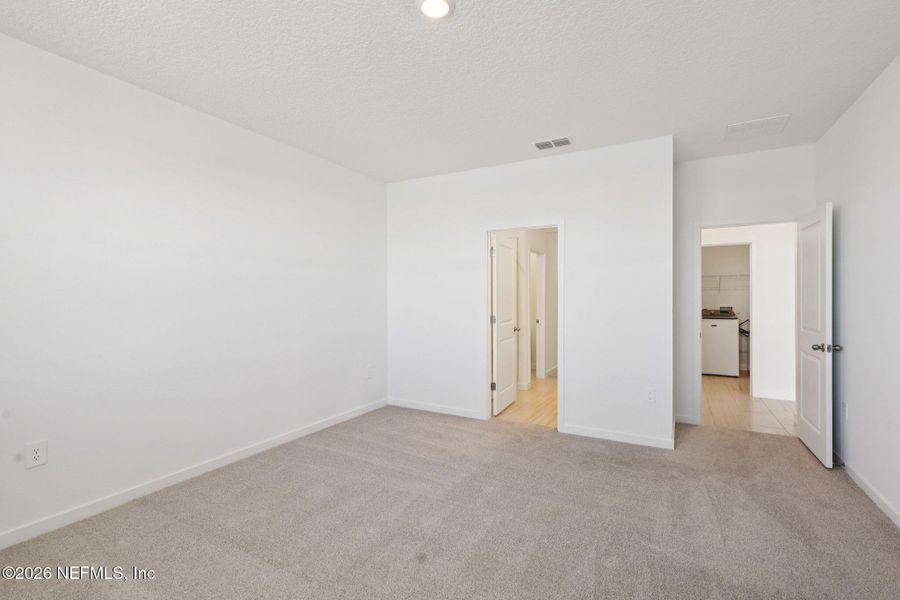 Spacious, unfurnished interior of a new home in Lakes at Bella Lago - Signature Series, Green Cove Springs (Image 26).