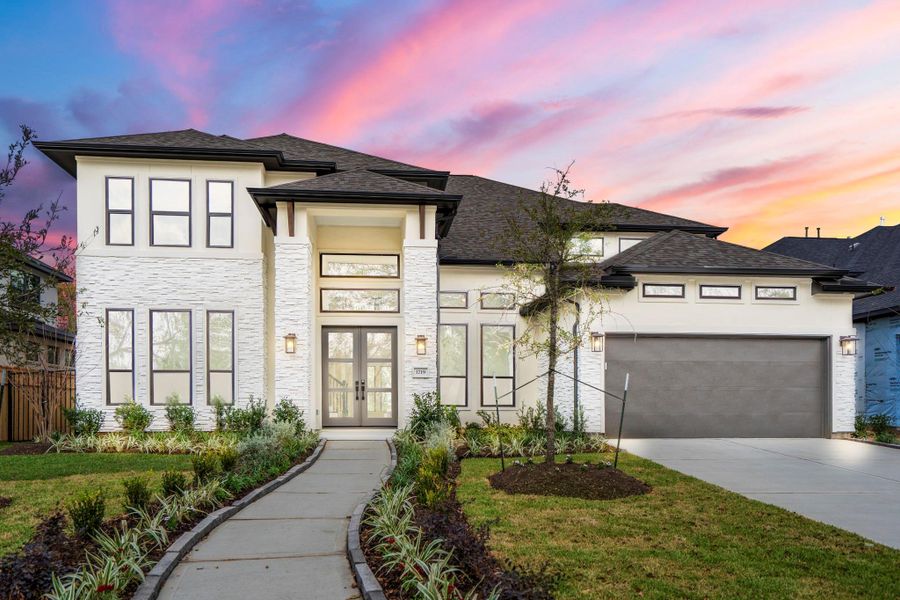 Front exterior of a new home in Sienna 70' Lots, Missouri City, TX, highlighting curb appeal (Image 2). Front exterior of a new home in Sienna 70' Lots, Missouri City, TX, highlighting curb appeal (Image 2).