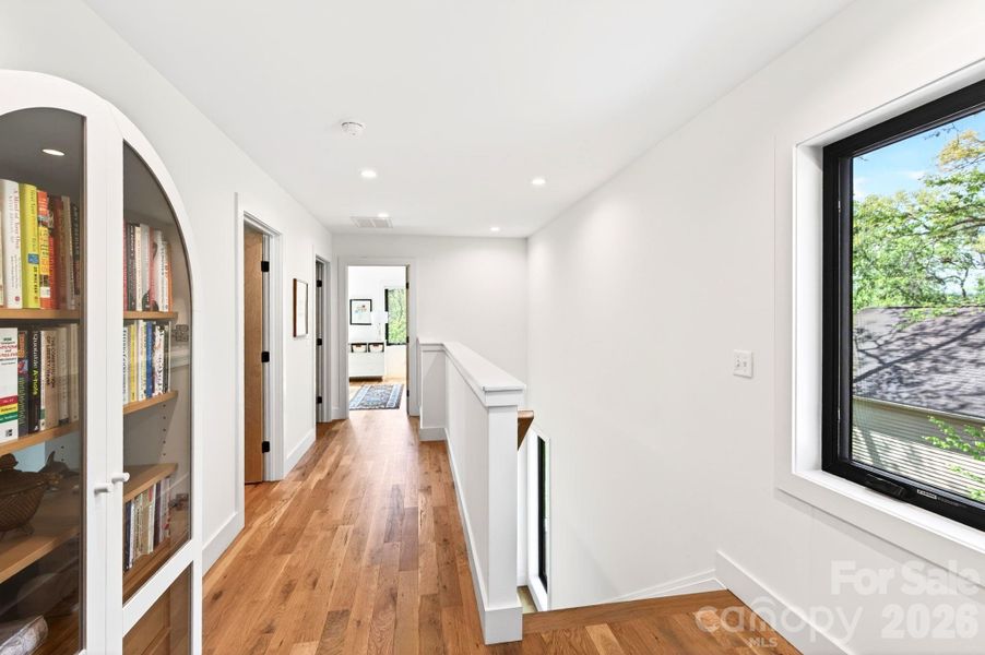 Hallway Leads to 3 Bedrooms, Full Bath, and Laundry