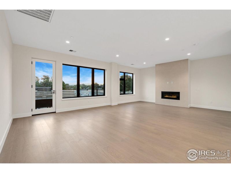 A HUGE dining and living space looks right onto your patio with mountain views galore and a cozy fireplace.