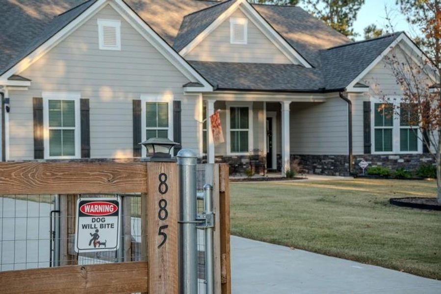 Front exterior of a new home in Crossing Creeks, Monroe, GA, highlighting curb appeal (Image 2).