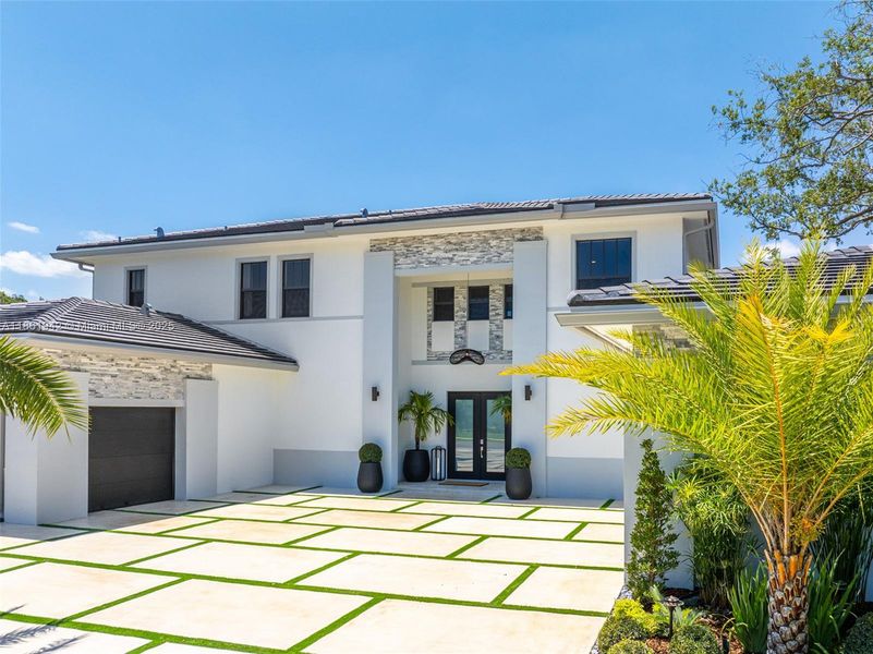 Front exterior of a new home in , Miami, FL, highlighting curb appeal (Image 32). Front exterior of a new home in , Miami, FL, highlighting curb appeal (Image 32).