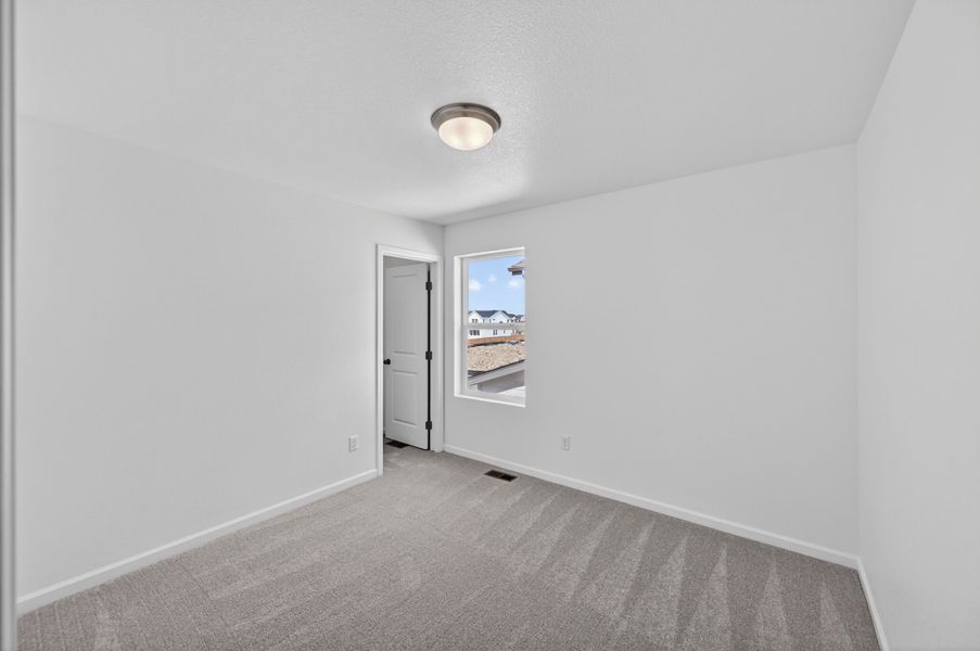 Spacious, unfurnished interior of a new home in Sky Ranch, Watkins (Image 13).