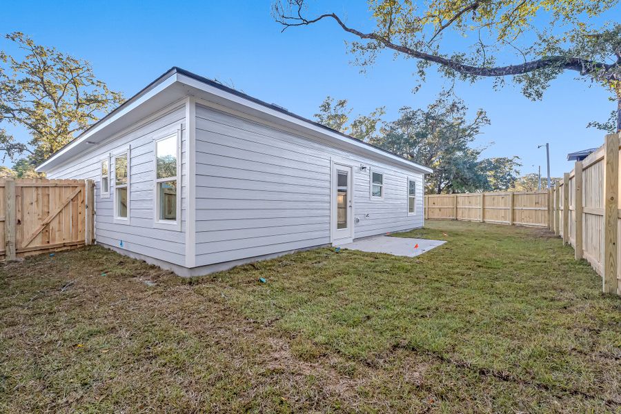 Exterior details and patio area of a home in Live Oak Cottages, Freeport (Image 32). Exterior details and patio area of a home in Live Oak Cottages, Freeport (Image 32).