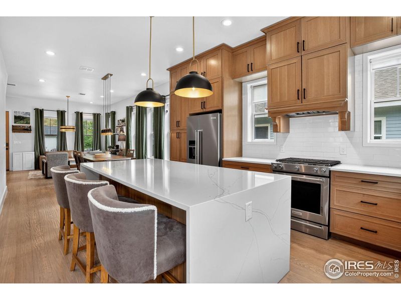 Floor to ceiling cabinets, all new stainless appliances, and a large island are the heart of this open floor plan home. Floor to ceiling cabinets, all new stainless appliances, and a large island are the heart of this open floor plan home.