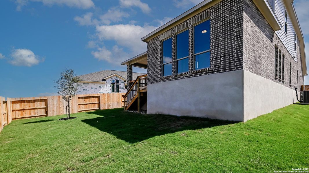 Front exterior of a new home in Homestead 55', Cibolo, TX, highlighting curb appeal (Image 27). Front exterior of a new home in Homestead 55', Cibolo, TX, highlighting curb appeal (Image 27).
