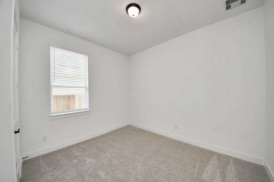 Spacious, unfurnished interior of a new home in Meridiana Courtyard Collection, Manvel (Image 30).