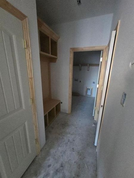 Mudroom featuring concrete flooring
