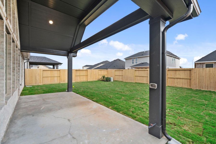Patio Retreat With Space For Dining And Lounging