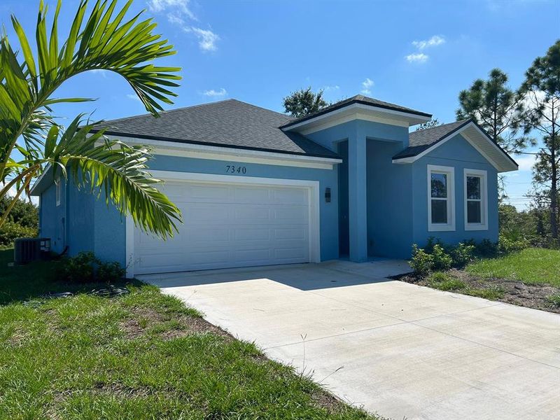 Front exterior of a new home in , Englewood, FL, highlighting curb appeal (Image 1). Front exterior of a new home in , Englewood, FL, highlighting curb appeal (Image 1).