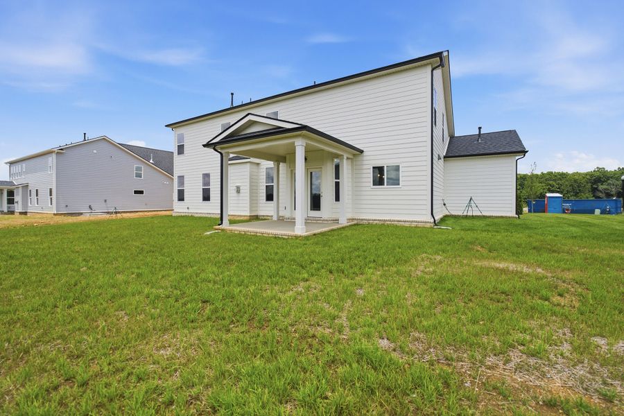 Exterior details and patio area of a home in Aden Woods, Fairview (Image 4).