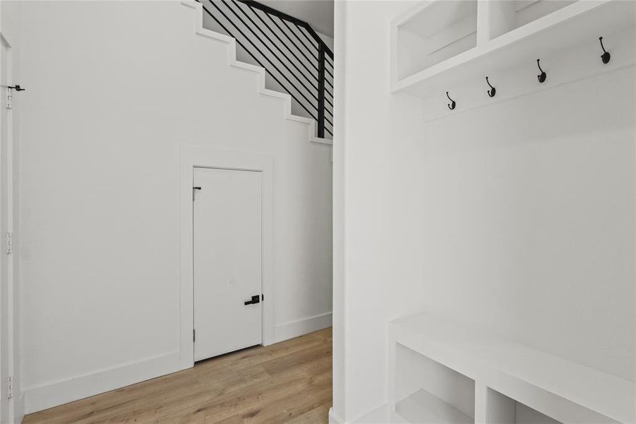 Mudroom featuring light wood finished floors and baseboards Mudroom featuring light wood finished floors and baseboards