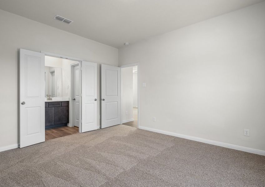 The master suite has a large bedroom, ensuite bathroom and a walk-in closet.