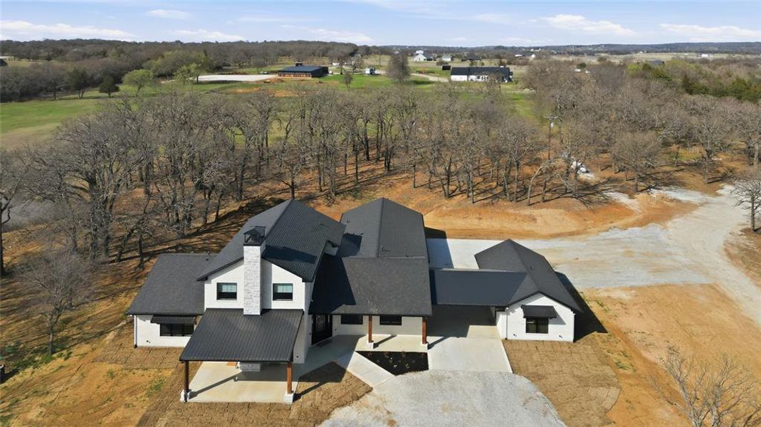 Front exterior of a new home in , Gainesville, TX, highlighting curb appeal (Image 20).