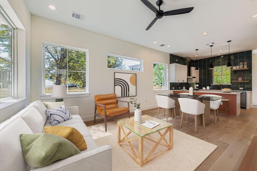Living area with recessed lighting, light wood-type flooring, and ceiling fan Living area with recessed lighting, light wood-type flooring, and ceiling fan