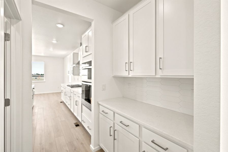 Furnished interior view inside a new home in Cordovan, Firestone (Image 7).