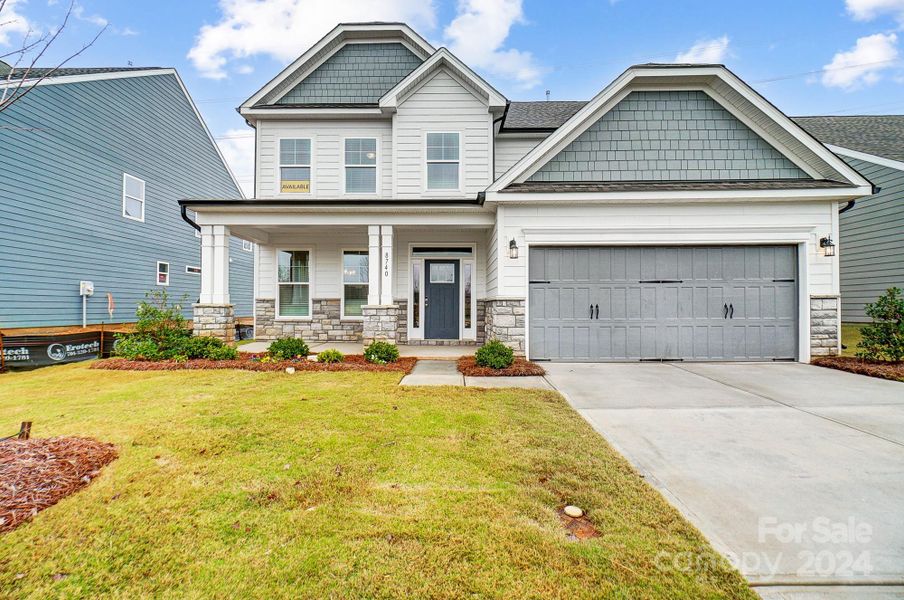 MOVE-IN READY! Homesite 602 features a Cypress F floorplan with front-load garage.