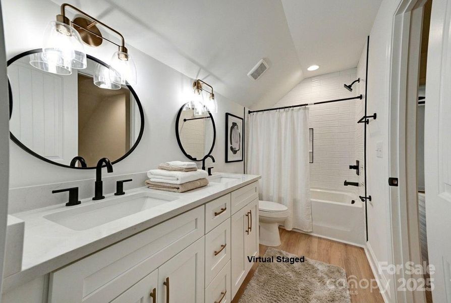 Upstairs bath with dual sinks. Door to hallway and to bedroom Upstairs bath with dual sinks. Door to hallway and to bedroom