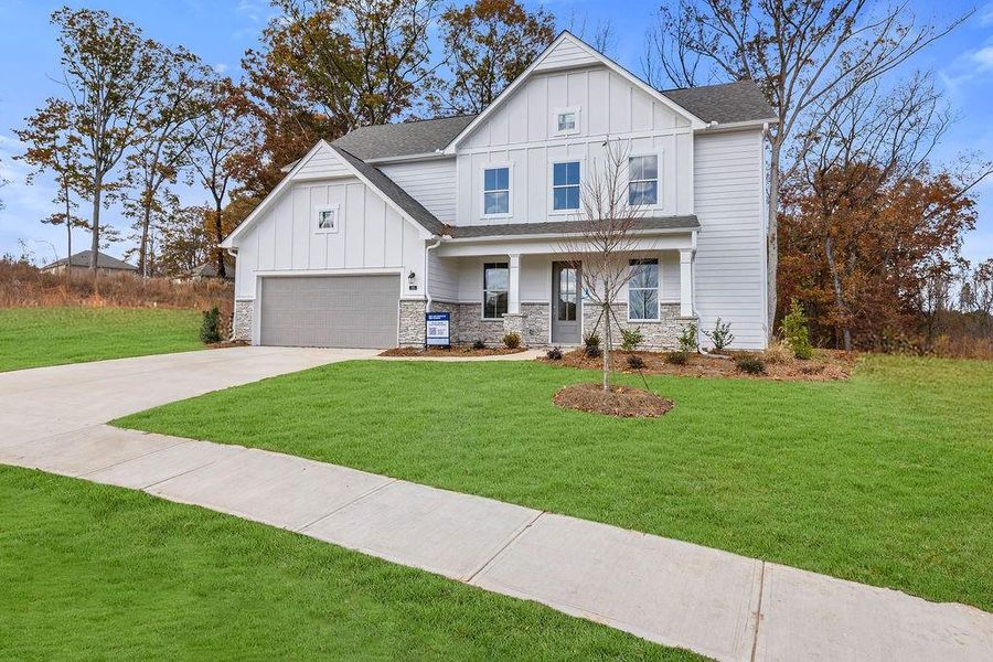 Front exterior of a new home in Maddox Landing, Hoschton, GA, highlighting curb appeal (Image 18).