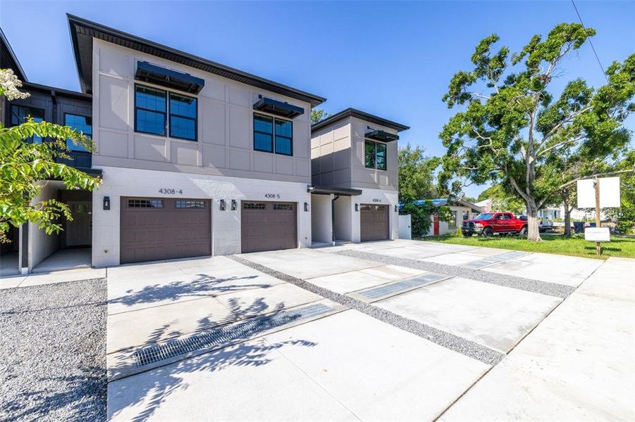 Front exterior of a new home in , Tampa, FL, highlighting curb appeal (Image 26).