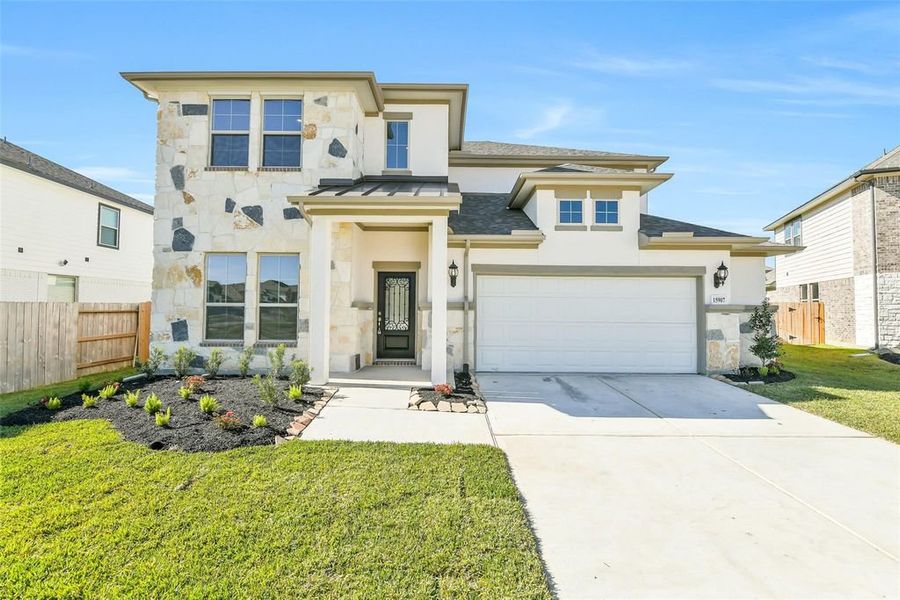 Front exterior of a new home in Stone Creek Ranch, Hockley, TX, highlighting curb appeal (Image 1). Front exterior of a new home in Stone Creek Ranch, Hockley, TX, highlighting curb appeal (Image 1).