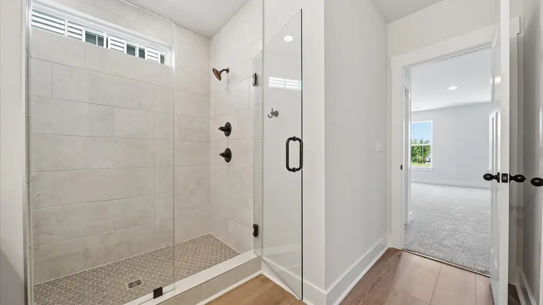 Highly functional and elegant en-suite with a tiled walk-in shower and refined finishes in Moore, SC