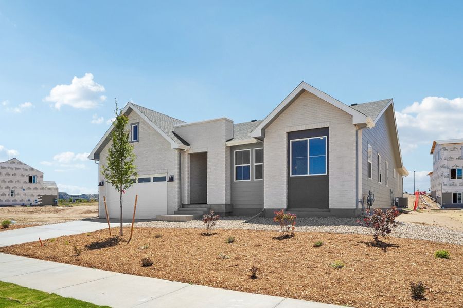 Front exterior of a new home in The Aurora Highlands, Aurora, CO, highlighting curb appeal (Image 2). Front exterior of a new home in The Aurora Highlands, Aurora, CO, highlighting curb appeal (Image 2).