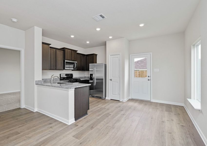 The kitchen and the dining room sit next to eachother for functionality.