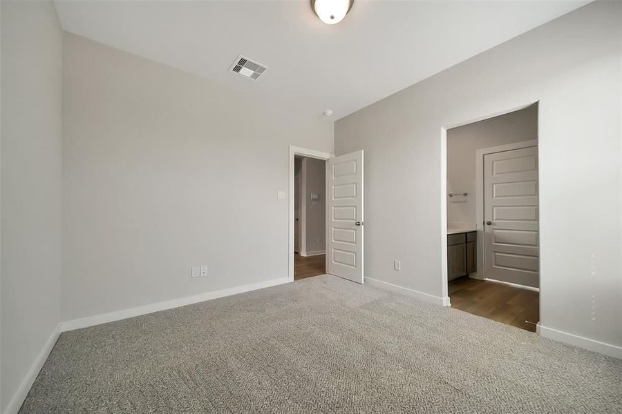 Spacious, unfurnished interior of a new home in Sunterra, Katy (Image 42).
