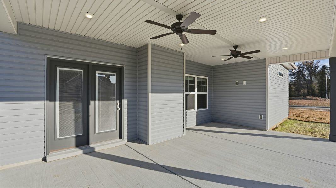 covered back porch with ceiling fans, cable outlet for the flat screen tv