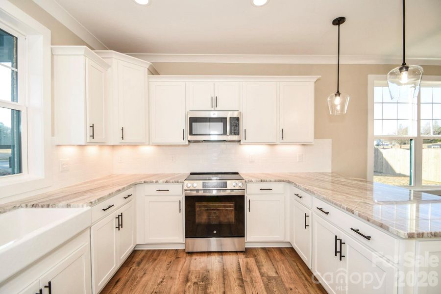 Furnished interior view inside a new home in , Wingate (Image 10).