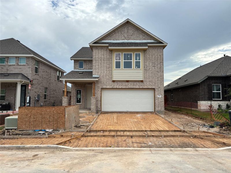 Front exterior of a new home in Berry Creek Highlands, Georgetown, TX, highlighting curb appeal (Image 23). Front exterior of a new home in Berry Creek Highlands, Georgetown, TX, highlighting curb appeal (Image 23).
