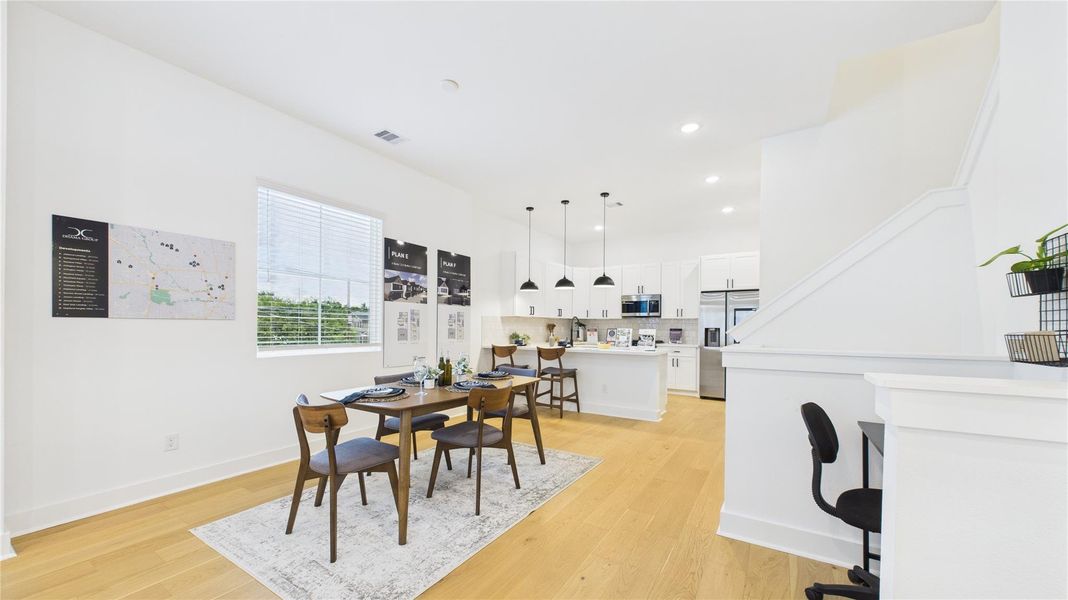 With seamless transitions between the living, dining, and kitchen areas, this space fosters effortless entertaining and everyday comfort. High ceilings, elegant finishes, and a spacious feel make this area a true centerpiece of the home, perfect for gatherings or quiet relaxation. With seamless transitions between the living, dining, and kitchen areas, this space fosters effortless entertaining and everyday comfort. High ceilings, elegant finishes, and a spacious feel make this area a true centerpiece of the home, perfect for gatherings or quiet relaxation.