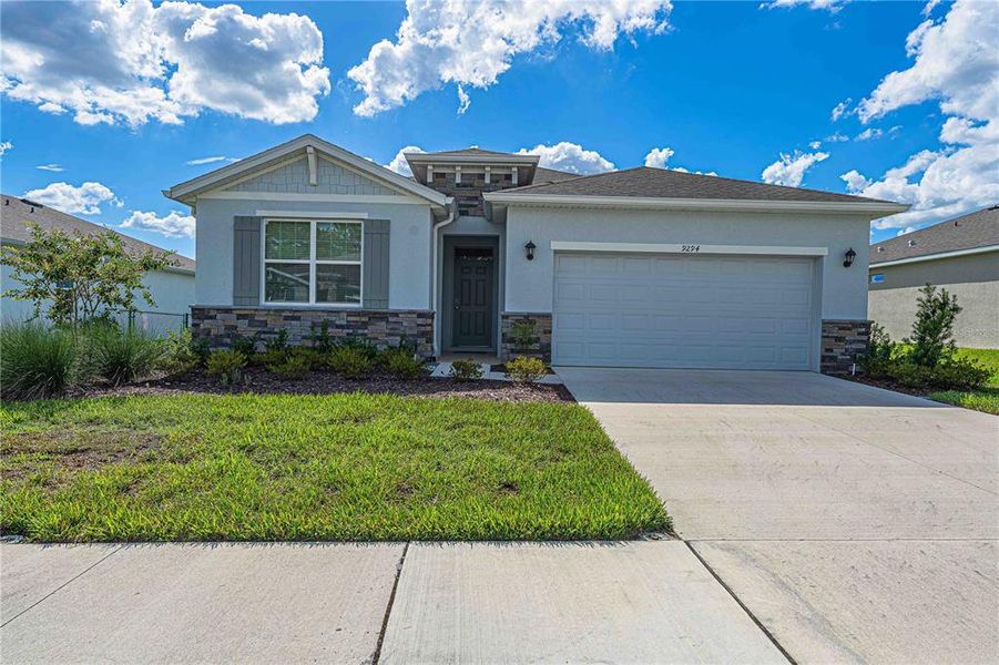 Front exterior of a new home in JB Ranch, Ocala, FL, highlighting curb appeal (Image 27).