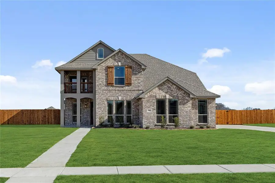 Front exterior of a new home in Crystal Lake Estates, Red Oak, TX, highlighting curb appeal (Image 2).